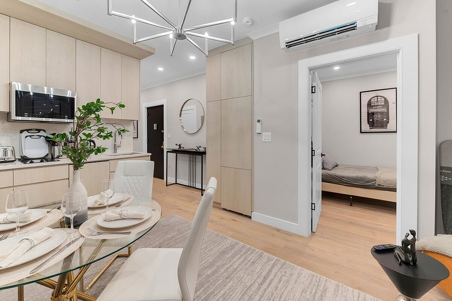 Sun-filled open layout with chandelier and mini-split climate control in every room.