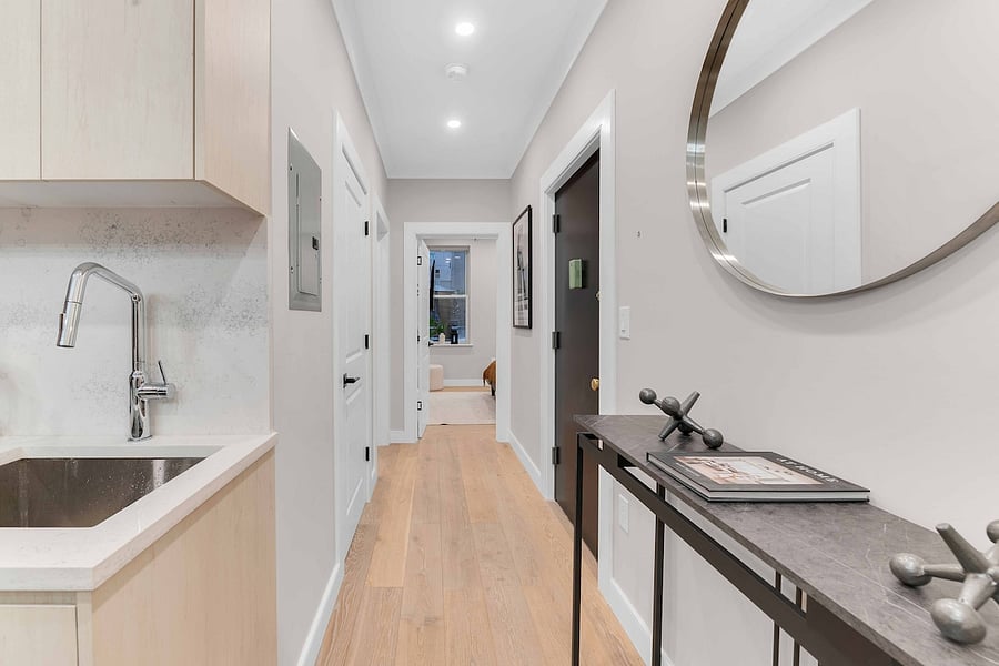 Renovated hallway connecting all three bedrooms.