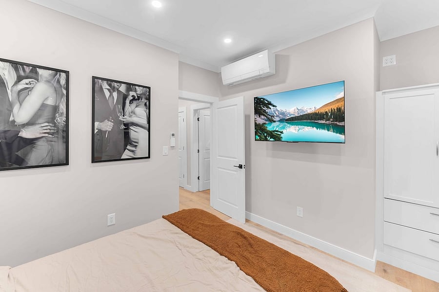 Cozy bedroom with smart TV and generous closet space.
