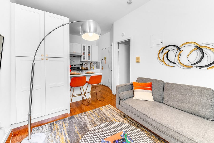 Open living-kitchen layout  bright, airy, and thoughtfully furnished.