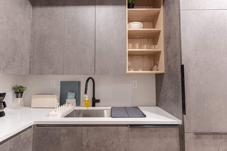 In-unit stacked washer and dryer tucked into a tidy closet  do laundry on your own schedule during your stay.