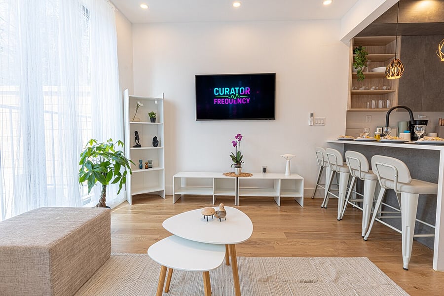 Open-plan layout flowing from the entry into a bright kitchen with bar seating.