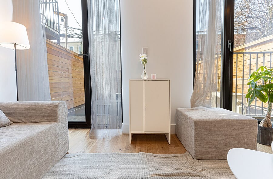 Dining-and-work nook with a desk beside the staircase to the duplex's second level.
