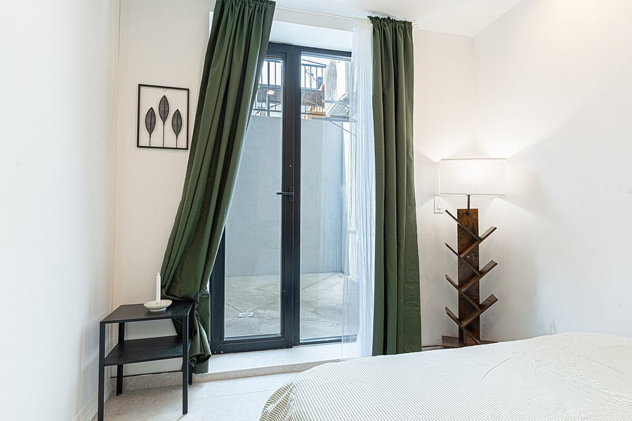 Cozy sleeping area with fresh linens and warm lighting  restful nights after busy days.