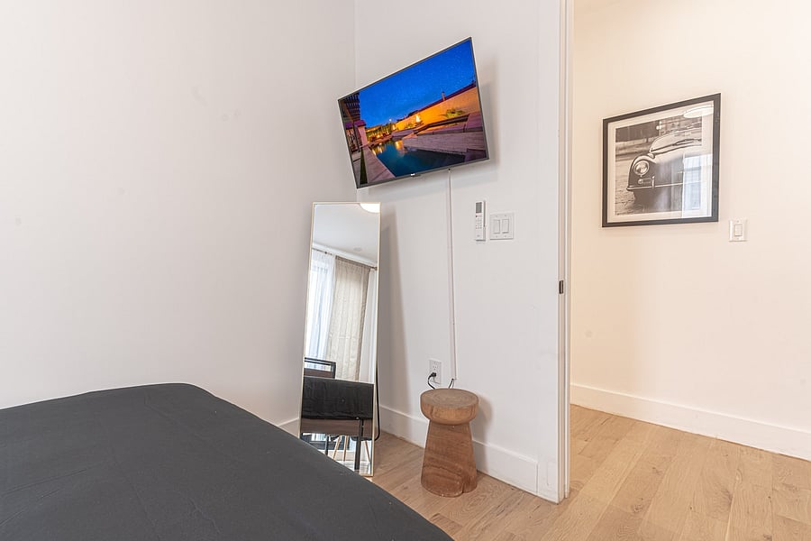 In-unit washer and dryer beside a full-size fridge  laundry day and groceries made easy.