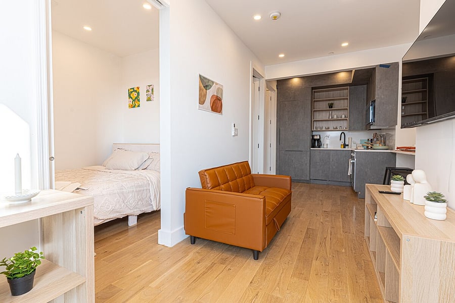 Spotless renovated bathroom with a fresh vanity towels and essentials provided.