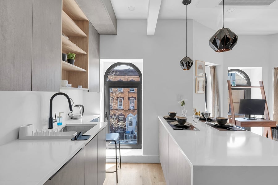 Stylish entry hallway with designer touches opening into the apartment.