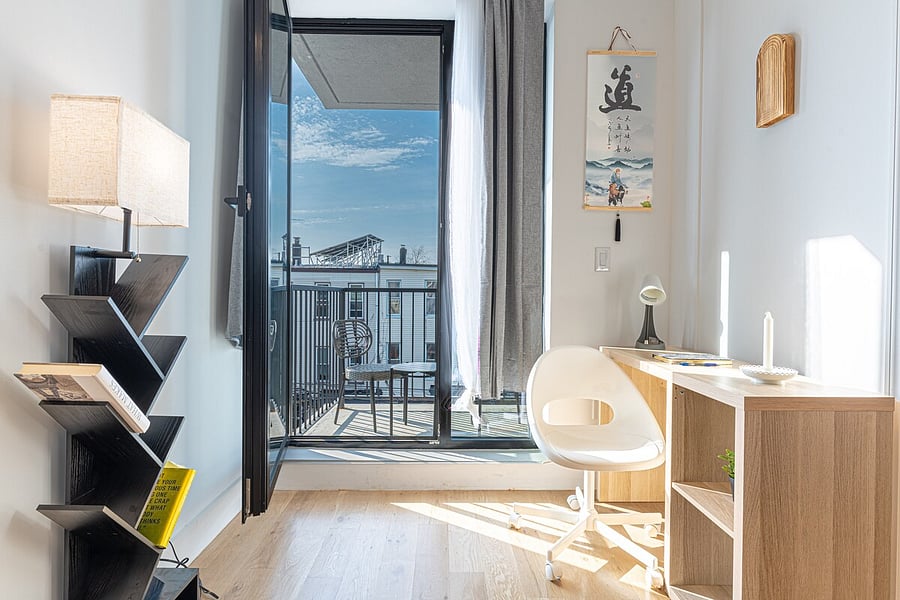 Plush, inviting bed in a bright renovated bedroom  sleep soundly.