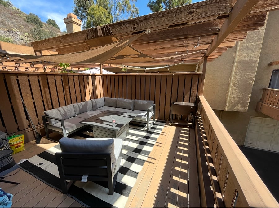 Large spacious patio with outdoor furniture and fire pit