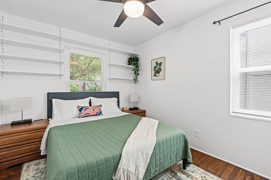 Bedroom 1. A true personal retreat. A plush king bed, real closet space to unpack, a full dresser, and a ceiling fan for perfect airflow. The kind of room that earns five stars just by letting you sleep well, night after night.
