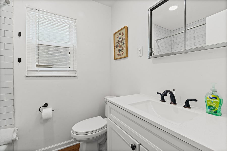 Full Bathroom. Updated and clean, with fresh tile and a full tub and shower.