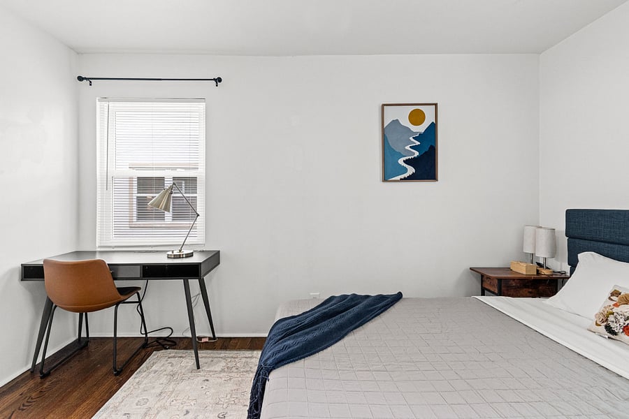 Bedroom 2. King bed plus a dedicated work desk, a combination that almost never exists in furnished rentals. Ideal for remote workers and nurses charting between shifts.
