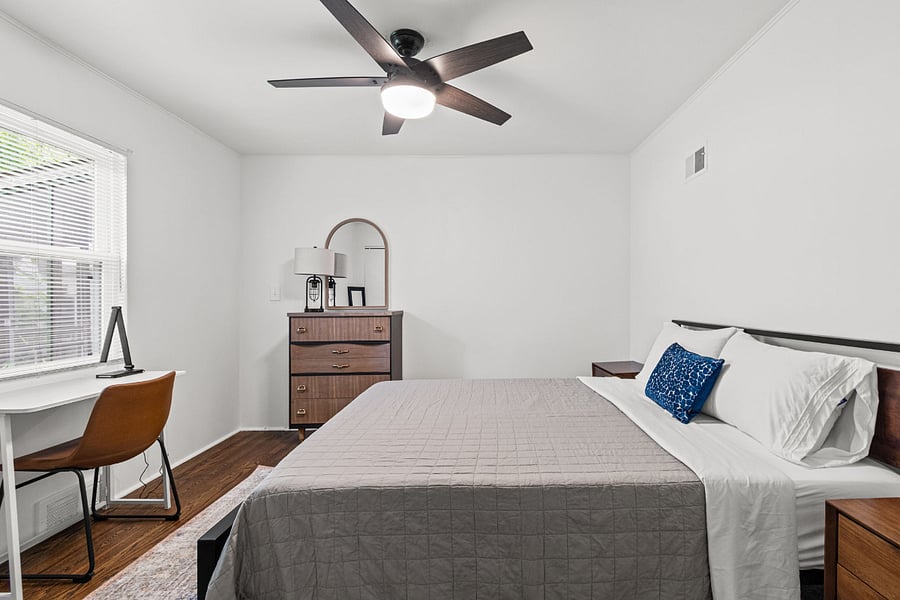 Bedroom 3. Another comfortable king bedroom with room for everyone in your group, plus a dedicated work desk, a combination that almost never exists in furnished rentals. 