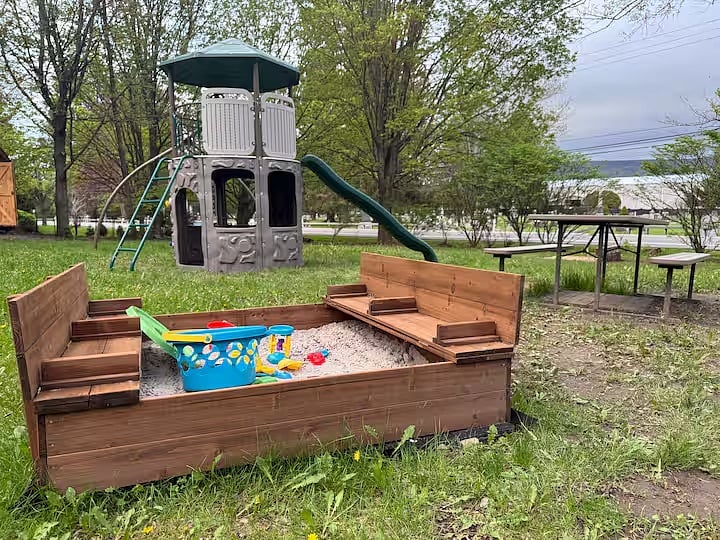 Swingset, sandbox, and picnic table