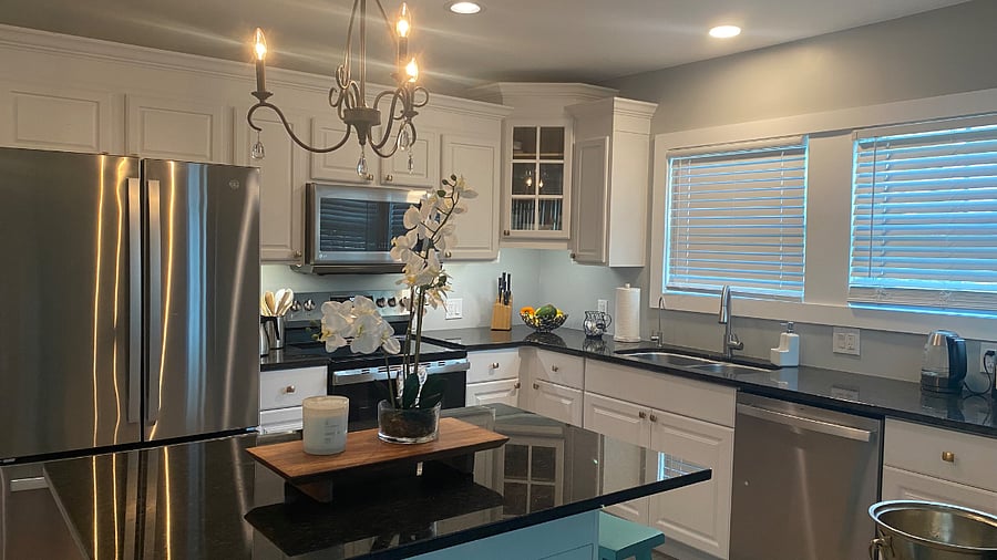"Alternative view of the bright, coastal-inspired kitchen."