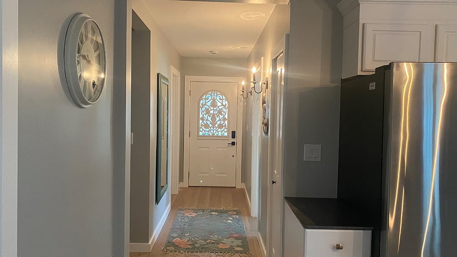 "Welcoming entry hallway featuring a decorative entry door and warm design details"