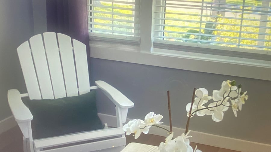 "Relaxing coastal chair creating a cozy retreat for reading and unwinding beautifully."