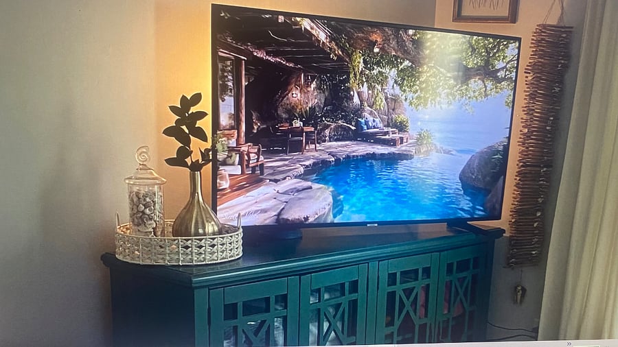 "Bright and airy master bedroom with king-size bed and flat-screen TV."