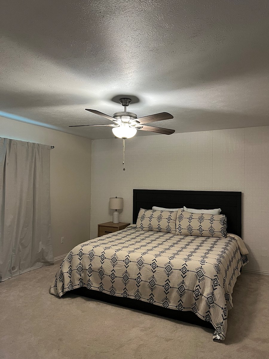 This king bedroom is tucked between the kitchen and garage on the opposite side of the house from the other three bedrooms. Ideal for a little extra privacy or a teenager!