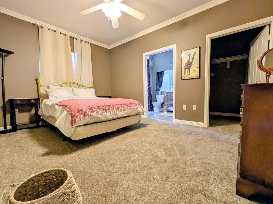Master suite with Queen bed, bedding, dresser, walk-closet, smart TV, and private bath.