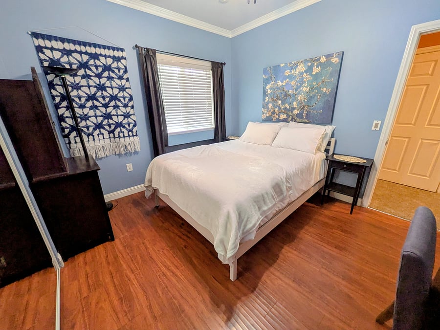 Second bedroom with Queen size bed, bedding,  desk, and large closet