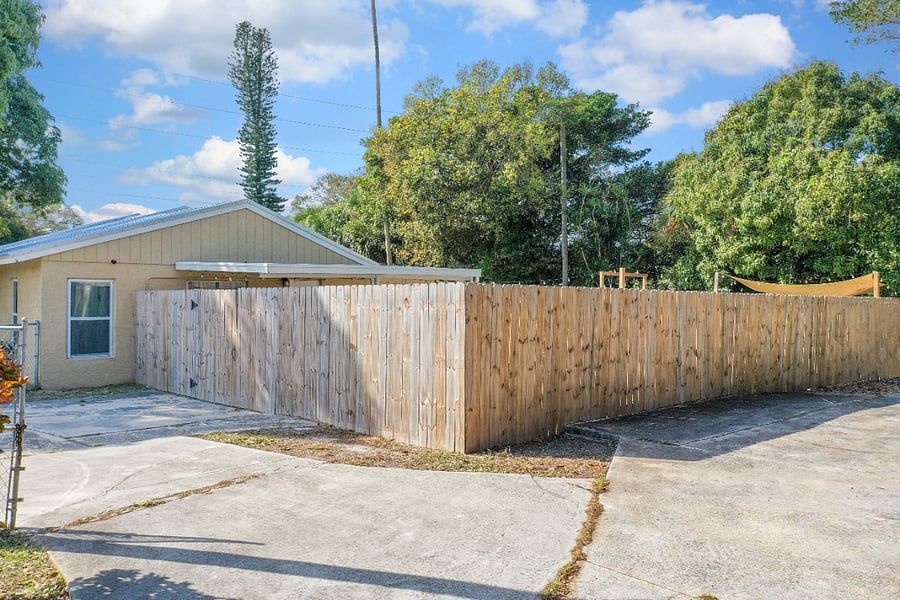 View of pedestrian gate leading to backyard.