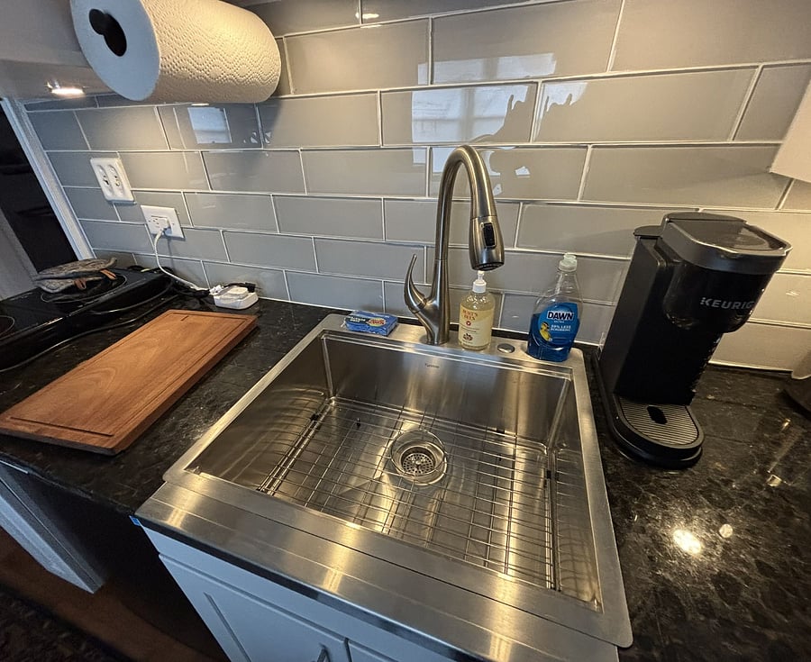 Full sink also has a cutting board