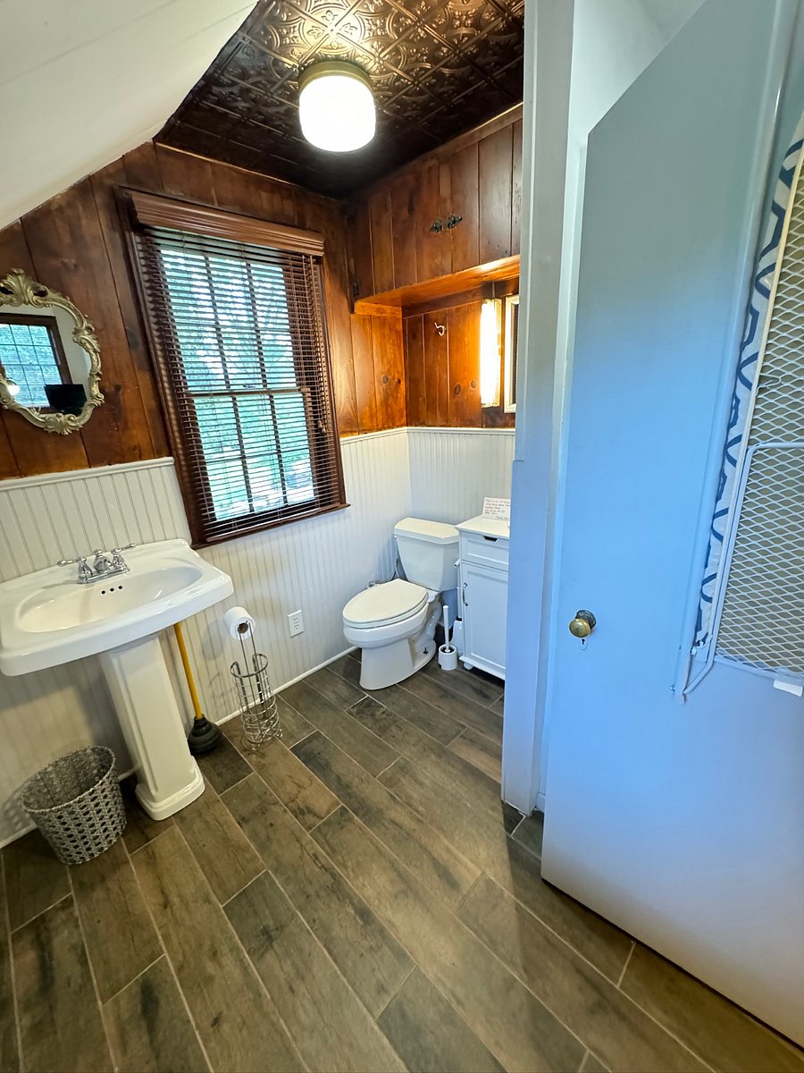 The bathroom also has a small washer