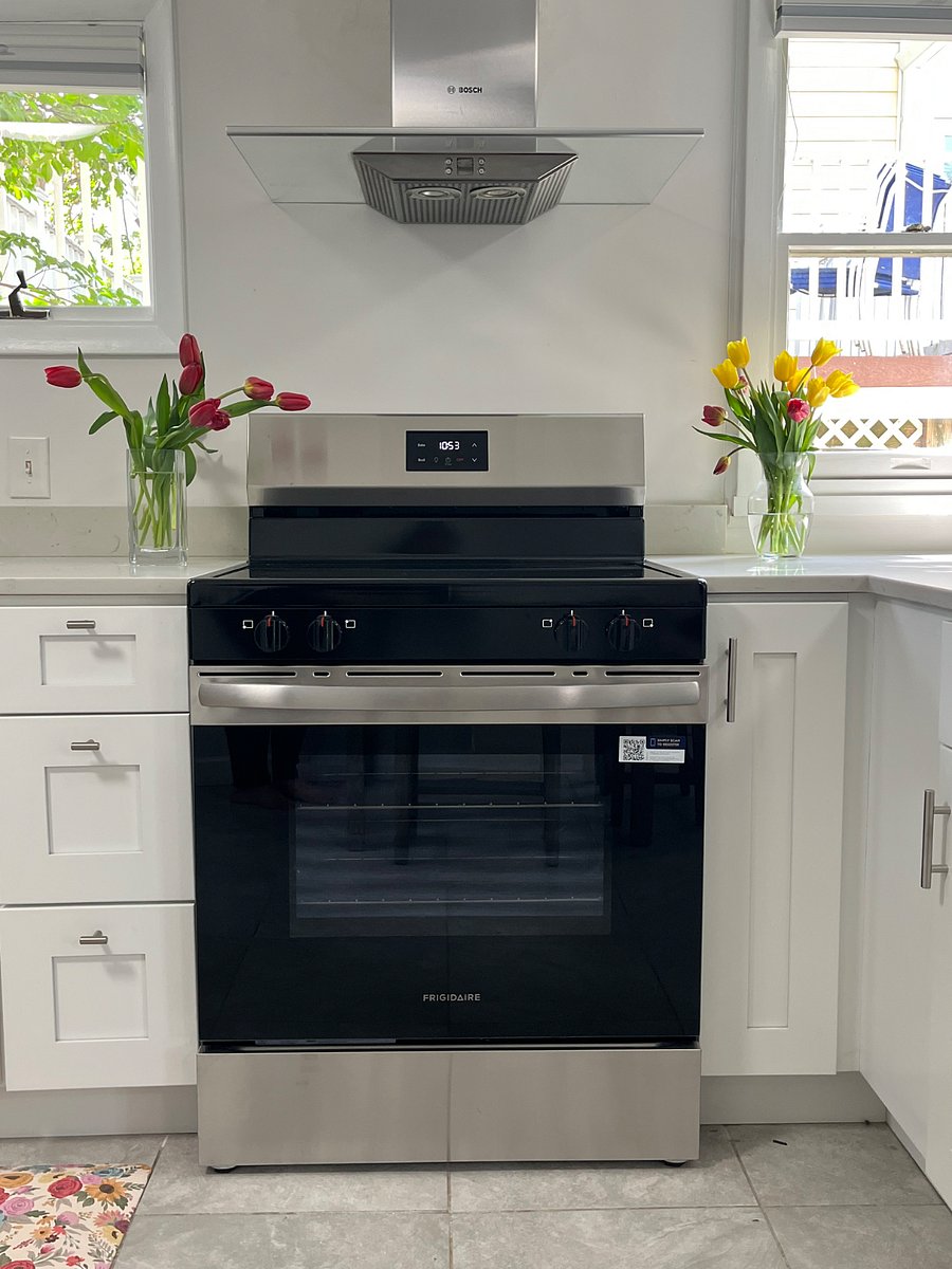 Fully equipped kitchen with stove, microwave, air fryer, coffee maker, and full sized fridge - all new appliances.