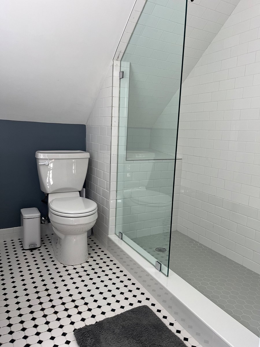 Bathroom with shower and single sink.