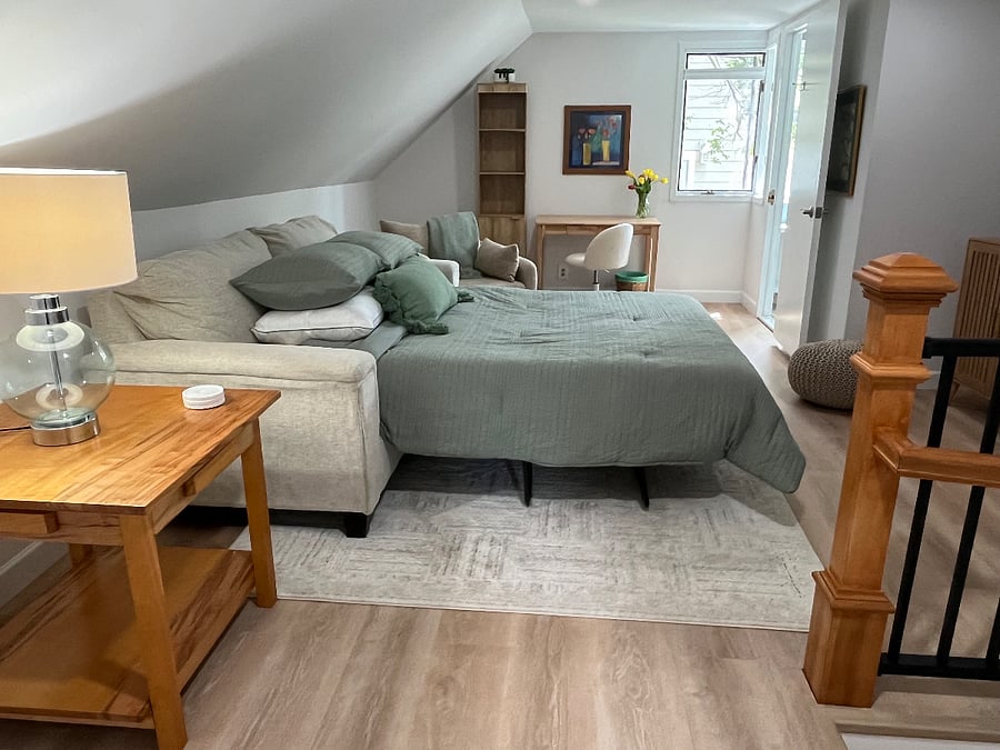 Upstairs sofa opens to a Queen sized pull out bed - brand new and great quality.