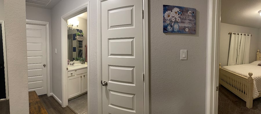 Private Passage Hallway from the Bedroom to Bathroom with a storage closet in between