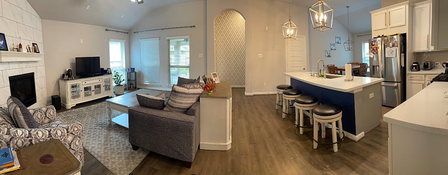 different view for the Leaving room and kitchen and the back porch in the back ground.