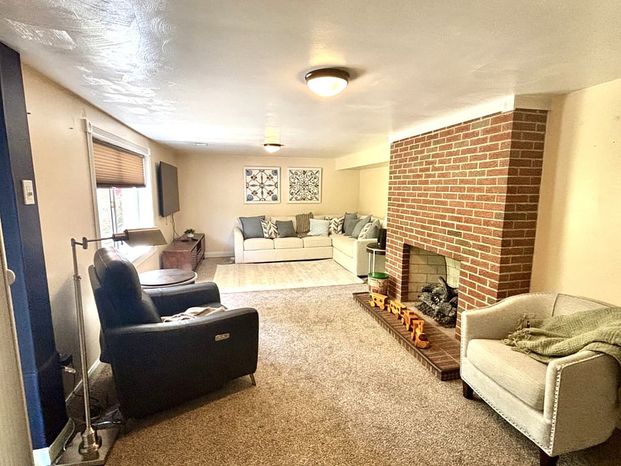 Family room with gas fireplace and slider to patio and back yard.