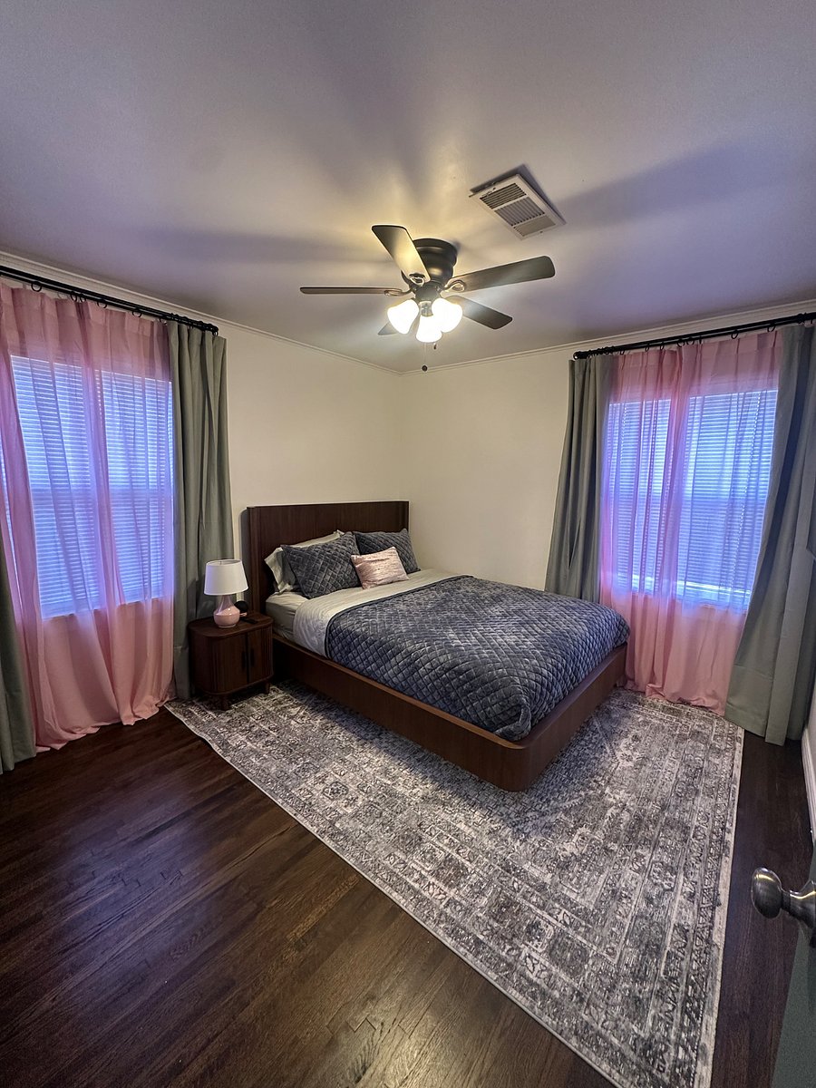 Bedroom two has a Queen-sized bed. It's a cheery, bright space.