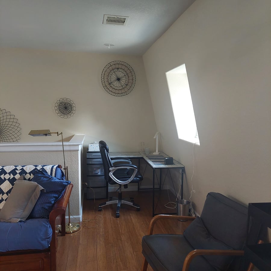 Study area with desk and chair.