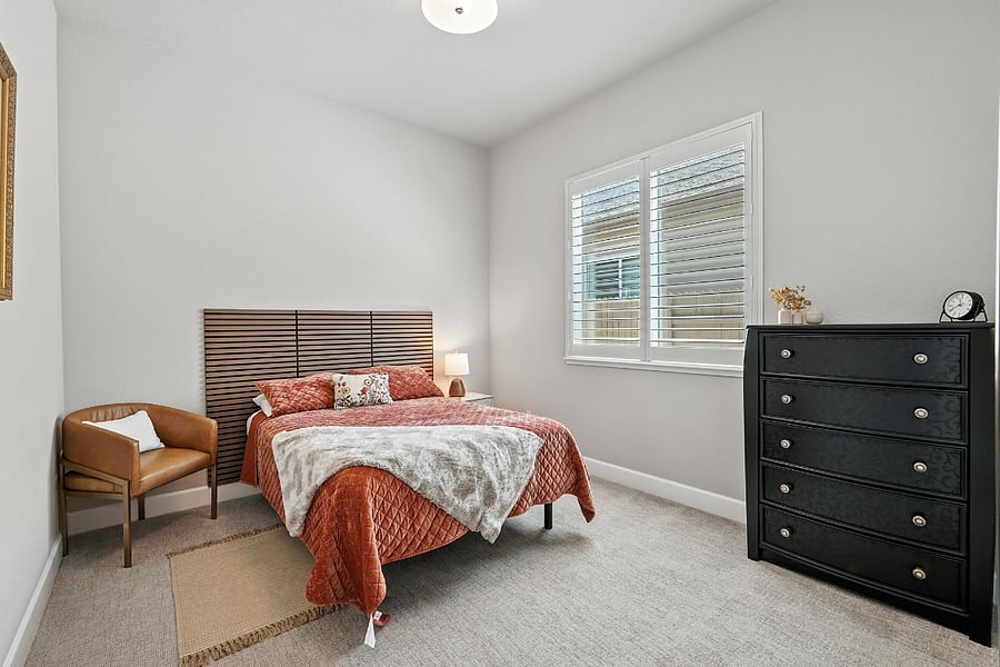 Bedroom #3 - Double Bed, dresser, nightstand w/ lamp, chair for sitting.