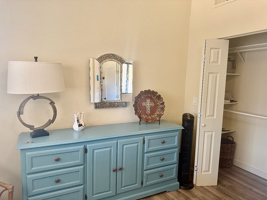 Primary bedroom dresser and closet