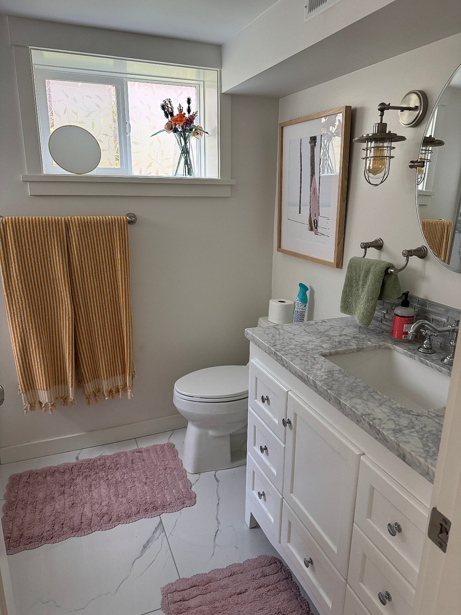 Your full sized bathroom, cleaning supplies under sink