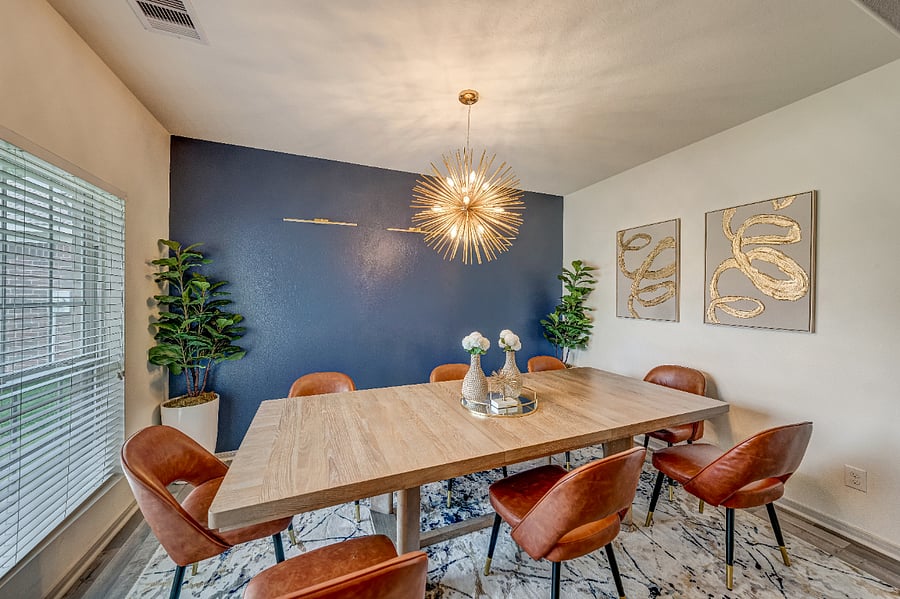 Large dining area with seating for up to 8 guests, perfect for family dinners, entertaining, or group meals.