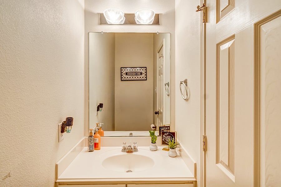 Convenient main-level half bath, perfect for guests and easy access from the homes common living areas.