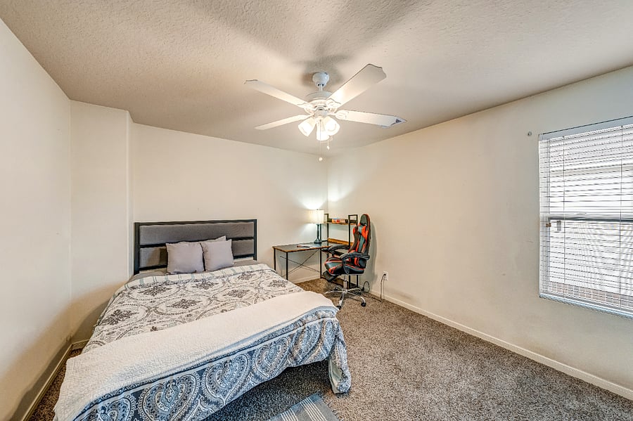 Well-appointed bedroom with a Smart TV, cozy accommodations, and ample closet space.