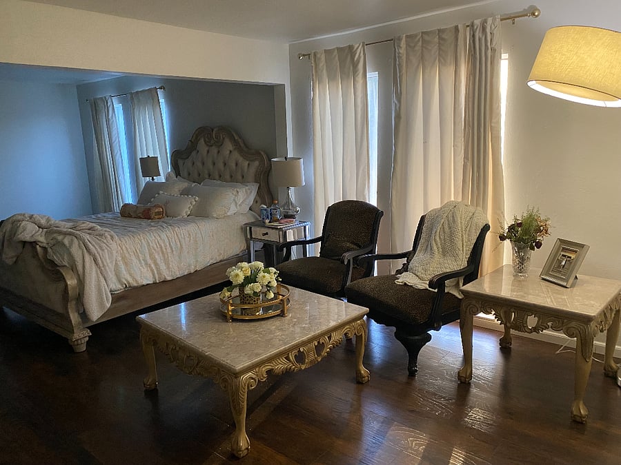 Upstairs bedroom has an attached movie area and separate sitting area. 