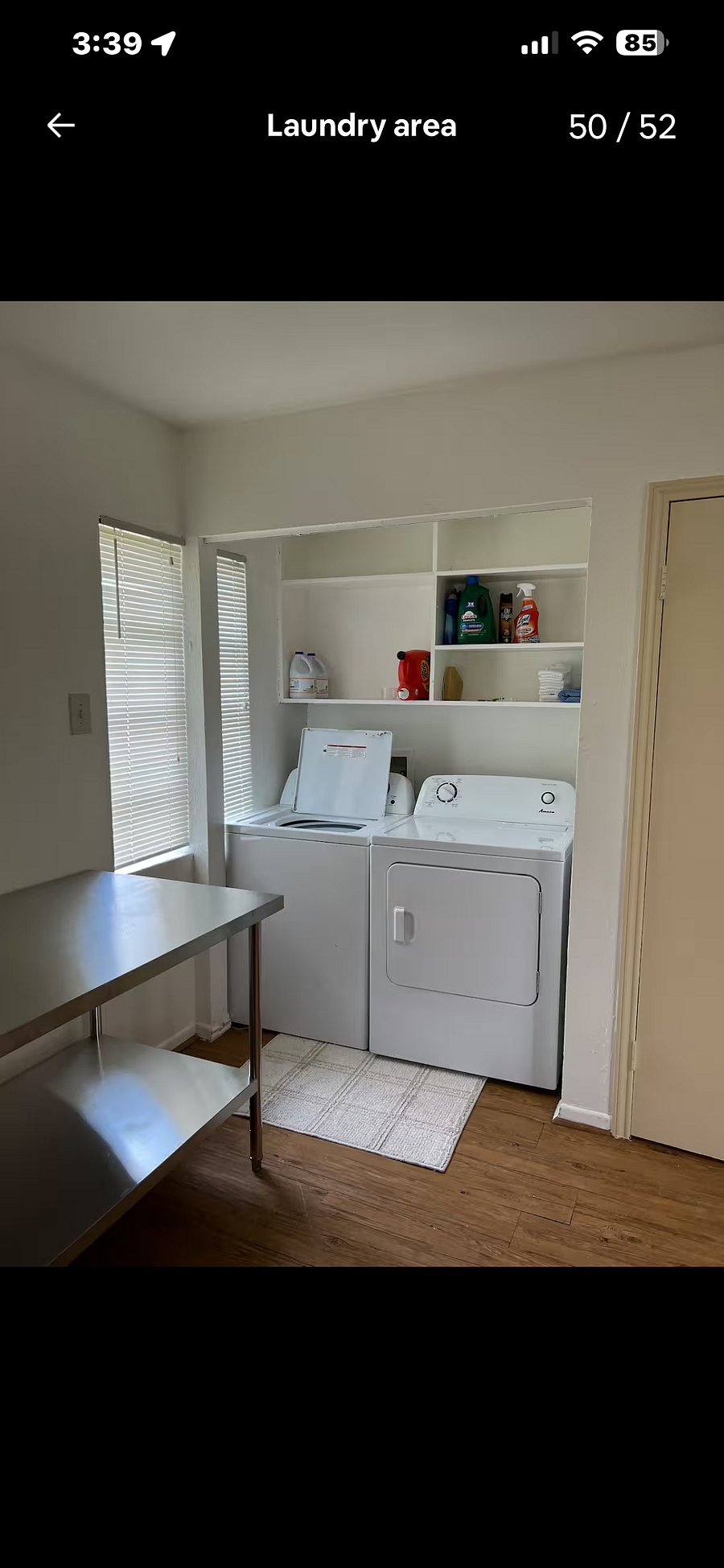 Laundry area with stainless steel folding table