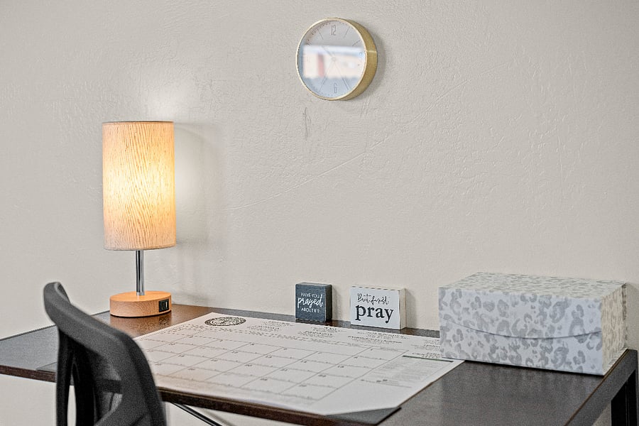 desk and chair and lamp for late night work with a charging station