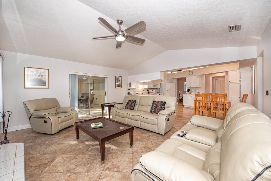 Spacious family room with 70-inch Smart TV and comfy fireplace.