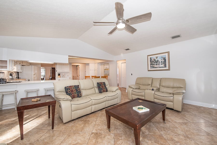 Spacious family room with 70-inch Smart TV and comfy fireplace.