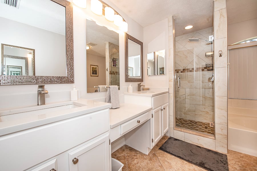 Oversized primary bath with double vanity, garden tub and walk-in shower.