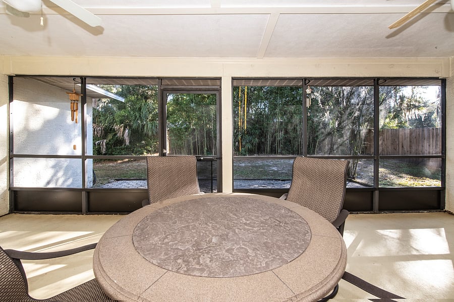 Outdoor dining on screened patio