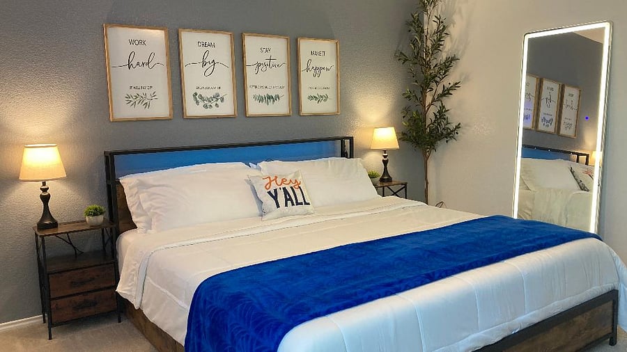 Master Bedroom, King Size bed and features a lighted full length mirror and a 65" 4K UHD Roku TV.